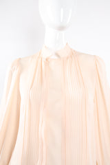 Vintage Oscar de la Renta Blush Silk Pintuck Blouse on Mannequin bust at Recess Los Angeles