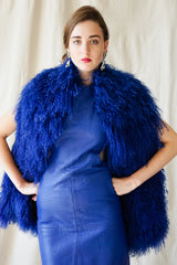 girl in Vintage Marvin Richards blue Mongolian Fur Vest & Climax leather dress @ Recess Los Angeles