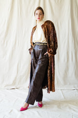 Girl in Vintage Diane Freis Plush Silk Tinsel Cape Coat & YSL leather pant at Recess Los Angeles