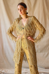 Girl in Vintage Badgley Mischka Mesh Fringe Jacket Gold Sequin Pant Set at Recess LA