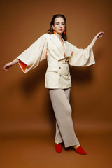 girl in Vintage Issey Miyake Double Jersey Pleated Pant & Gaultier jacket on brown @ Recess LA