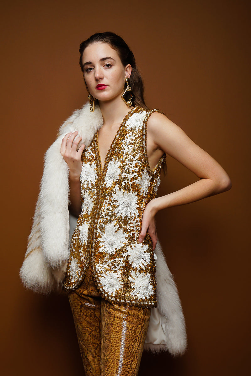 girl in Vintage Valentina Sequined Blossom Burst Vest and fox fur on brown at Recess Los Angeles