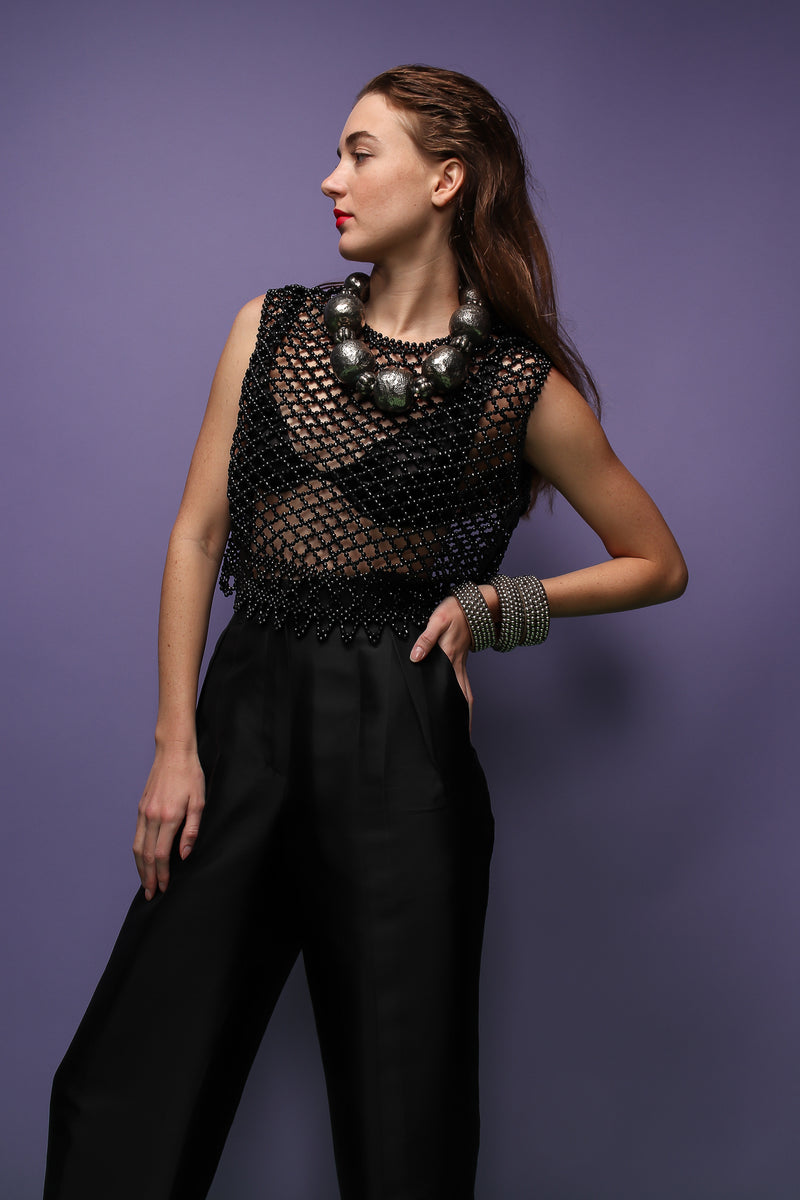 girl in Vintage 60s Bead Mesh Boxy Top & bra on purple background at Recess Los Angeles