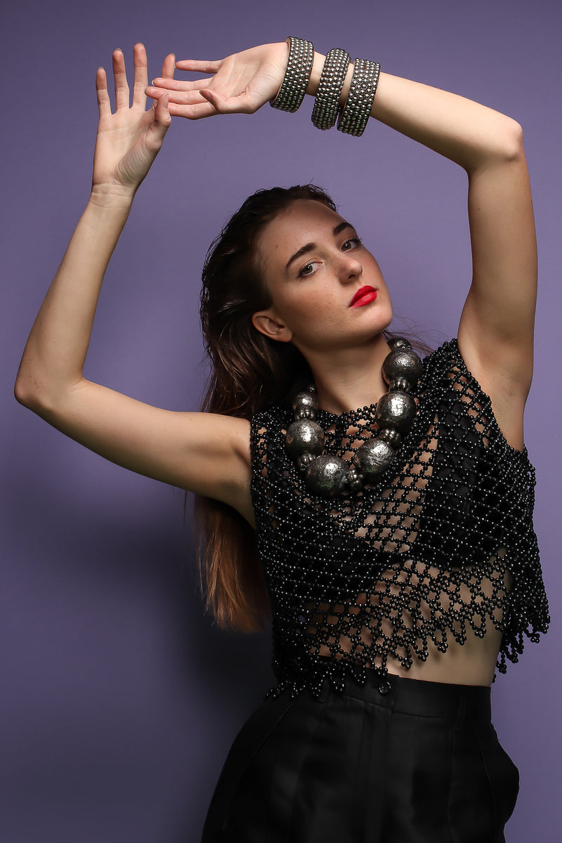 girl in Vintage 60s Bead Mesh Boxy Top & bra on purple background at Recess Los Angeles