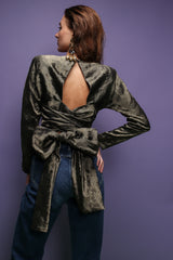 girl in Vintage Carolyne Roehm Metallic Backless Waist Wrap Top on purple background at Recess LA