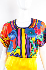 Vintage Escada Collage Pop Art Print Bodysuit on Mannequin front neck at Recess Los Angeles