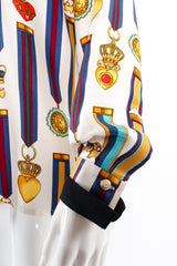 Vintage Escada Glamour Medals of Honor Print Blouse on mannequin sleeve cuff at Recess Los Angeles