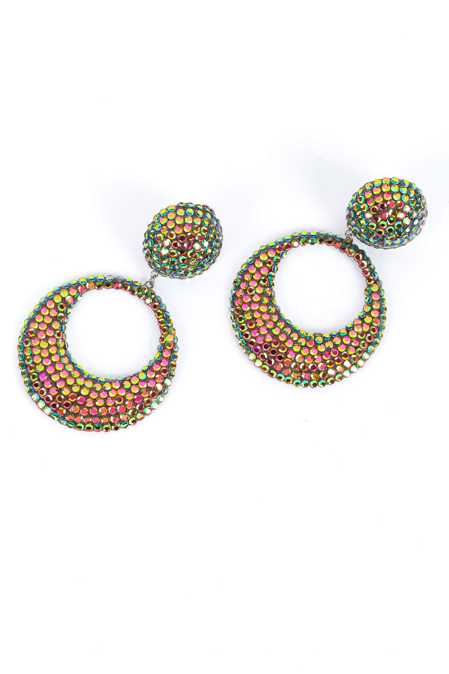 Iridescent vintage hoop earrings angled flat lay @recessla