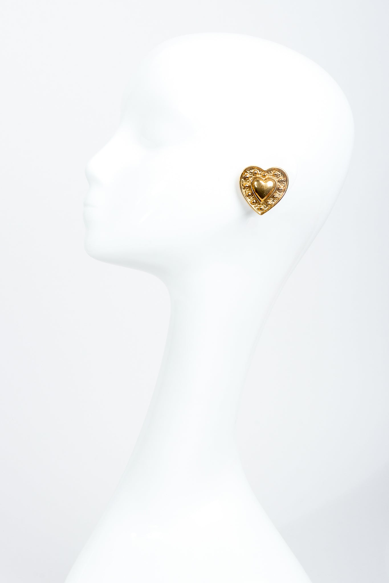 Vintage Yves Saint Laurent Gold Heart Button Clip Earrings on Mannequin at Recess Los Angeles