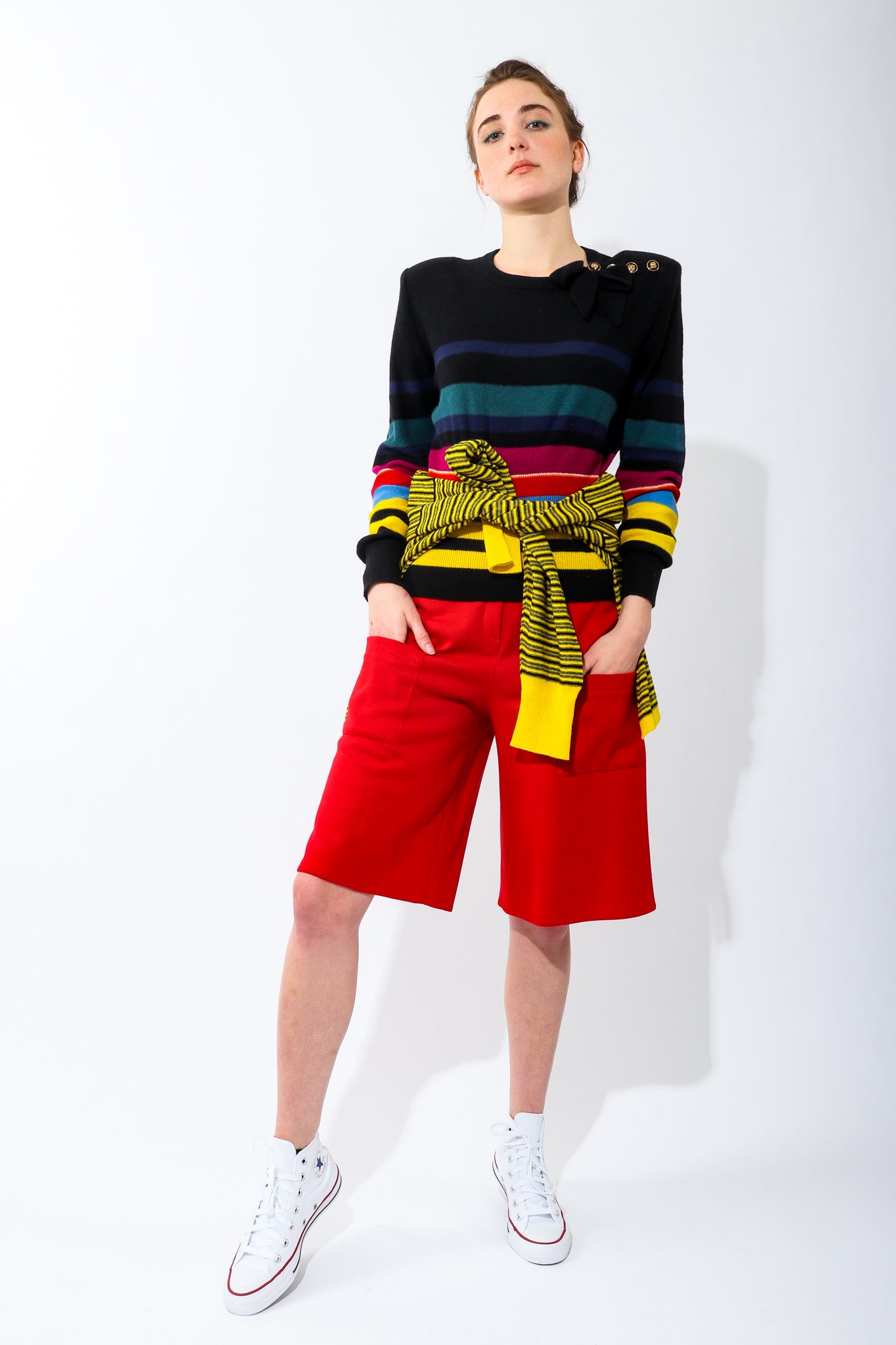 Girl Wearing Vintage Sonia Rykiel Rainbow Striped Knit Bow Sweater and red pant