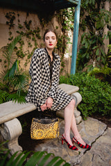 Girl wearing Vintage Sonia Rykiel Bouclé Buffalo Check Jacket & Skirt Set with red heels outside