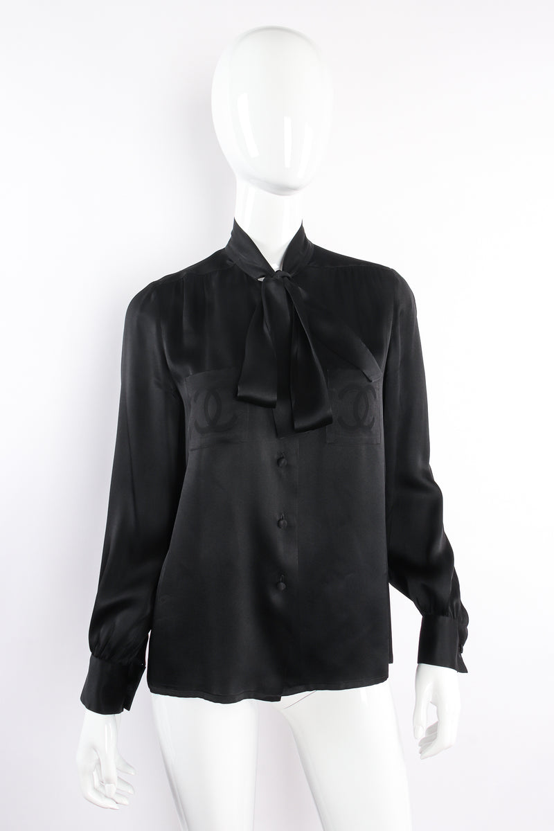 Vintage Chanel CC Pocket Black Silk Tie Neck Blouse on mannequin angle at Recess Los Angeles