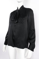 Vintage Chanel CC Pocket Black Silk Tie Neck Blouse on mannequin angle at Recess Los Angeles